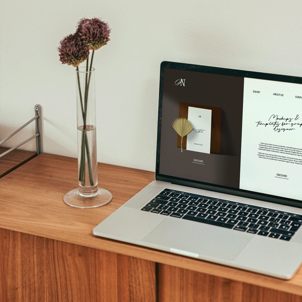 Free Macbook Mockup With 2 Flowers PSD