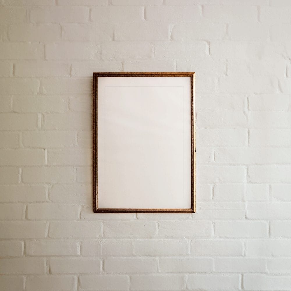 Free Metallic Frame on White Brick Wall Mockup PSD