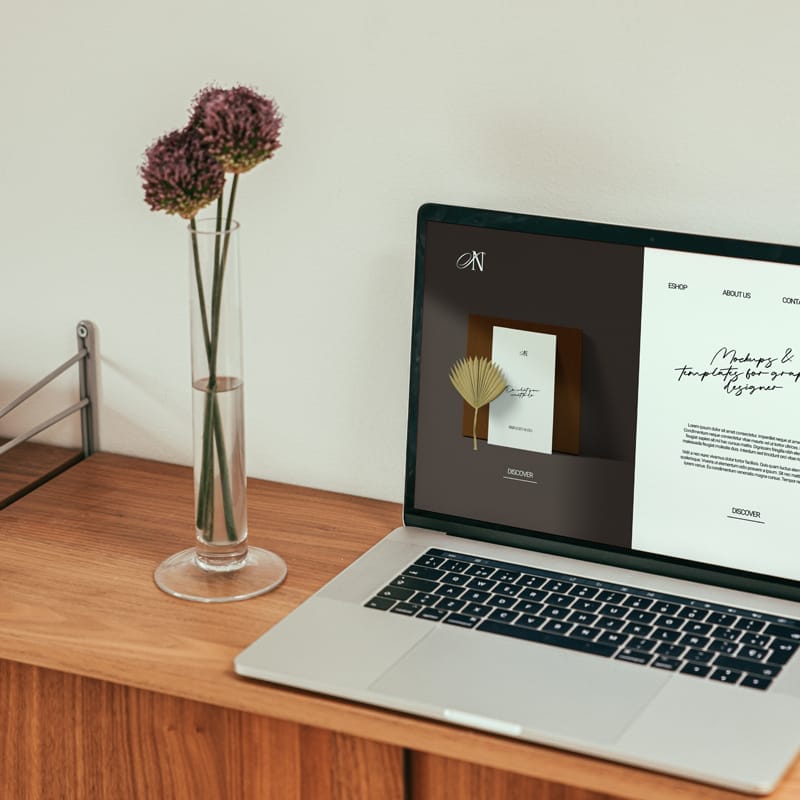 Macbook Mockup With 2 Flowers PSD