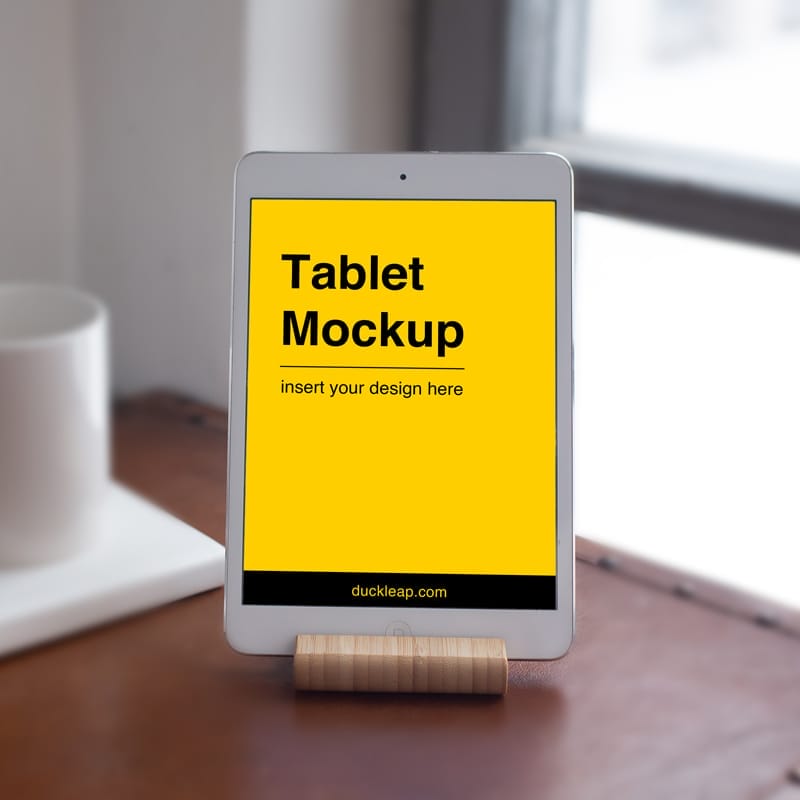 iPad on Wooden Stand Mockup PSD