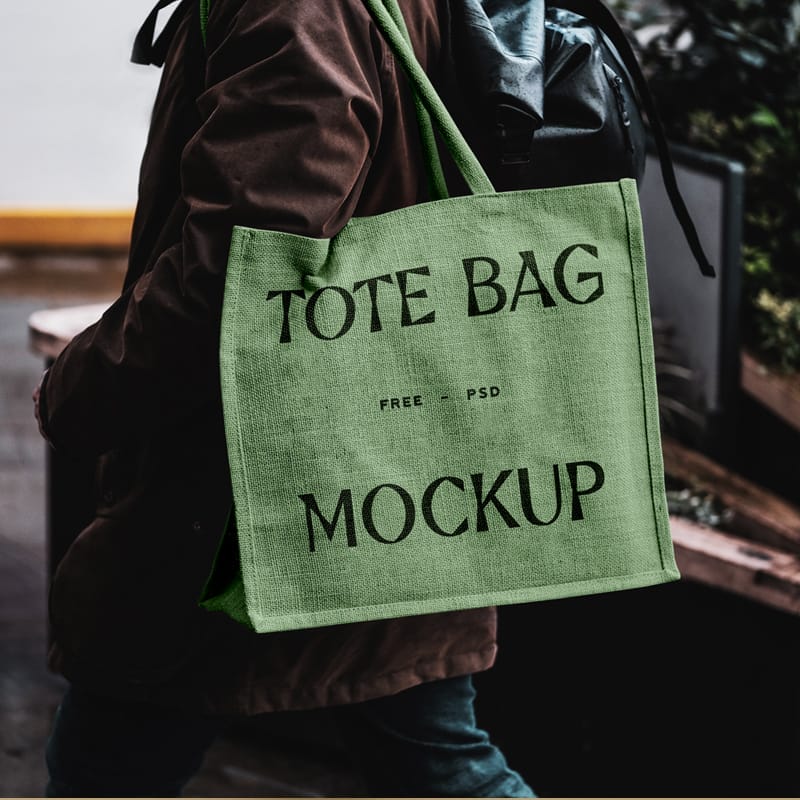 Eco Bag Carrying by Man Mockup PSD