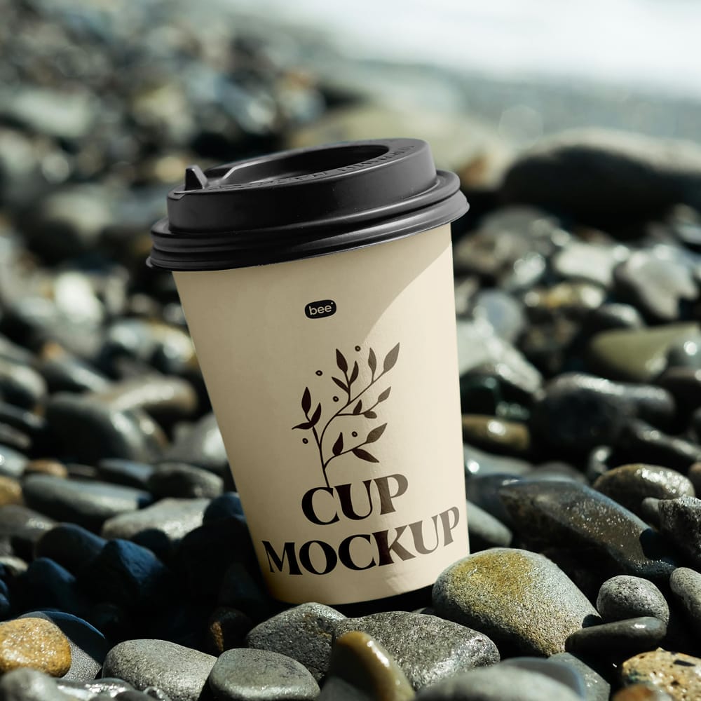 Free Paper Cup on Stone Beach Mockup PSD