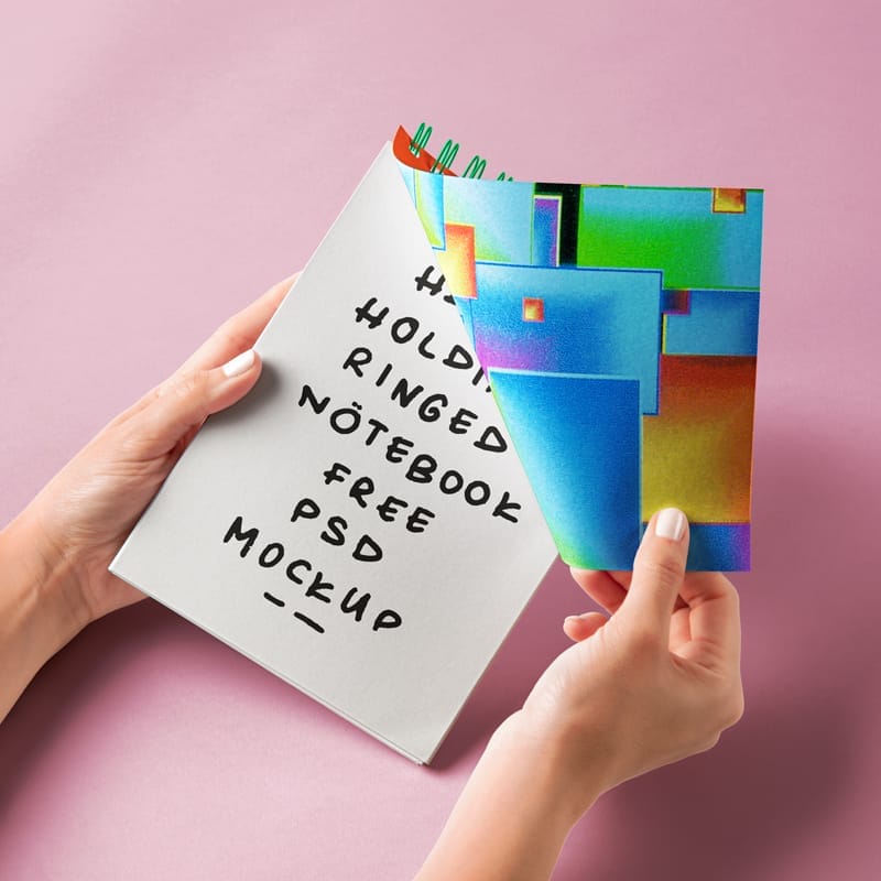 Hand Holding Ringed Notebook Mockup PSD