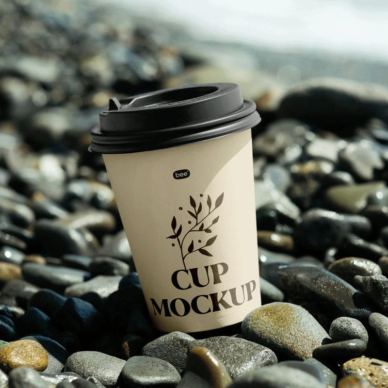 Paper Cup on Stone Beach Mockup PSD