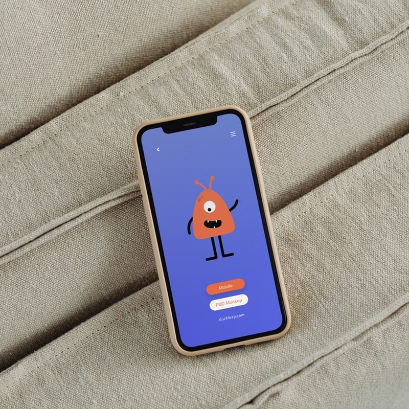 Smartphone On a Couch Mockup PSD