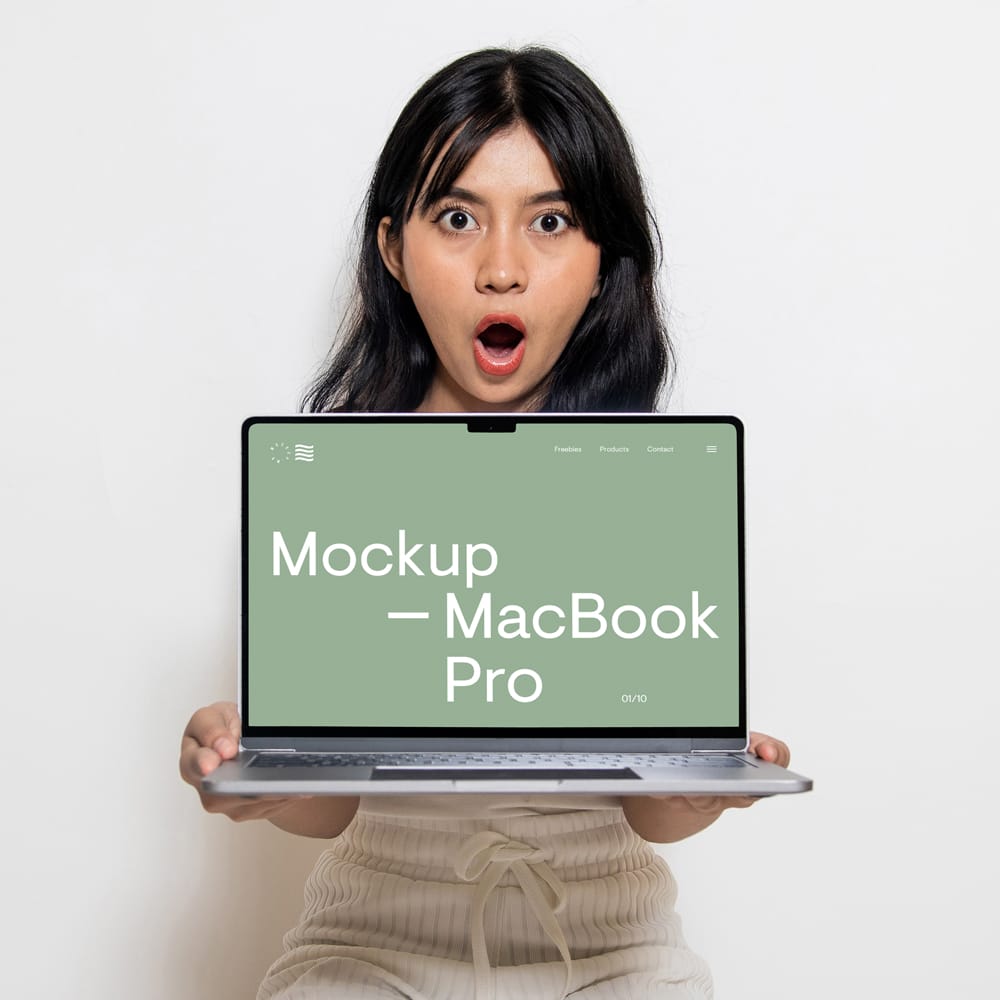 Free MacBook Pro Holding by Women Mockup PSD