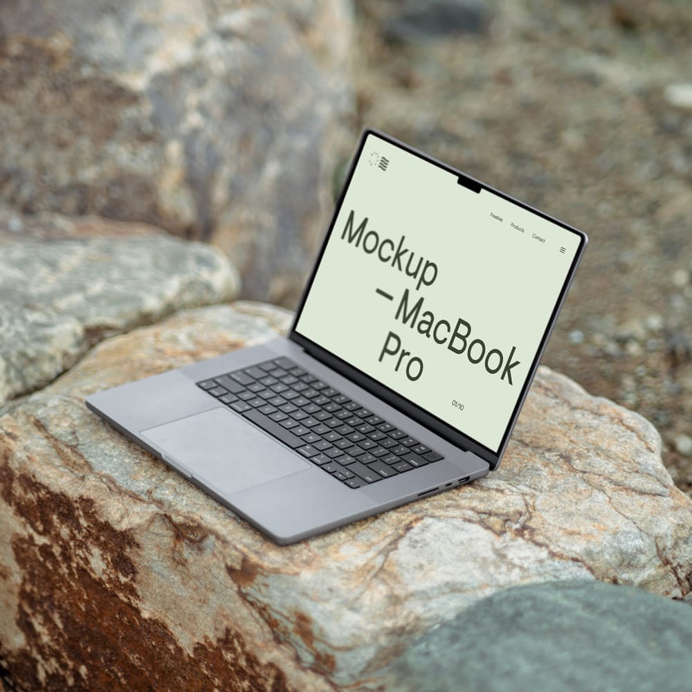 Free MacBook Pro on Rock Mockup PSD