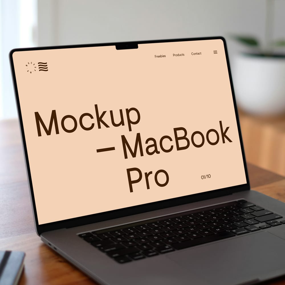 Free MacBook Pro on Wooden Desk Mockup PSD