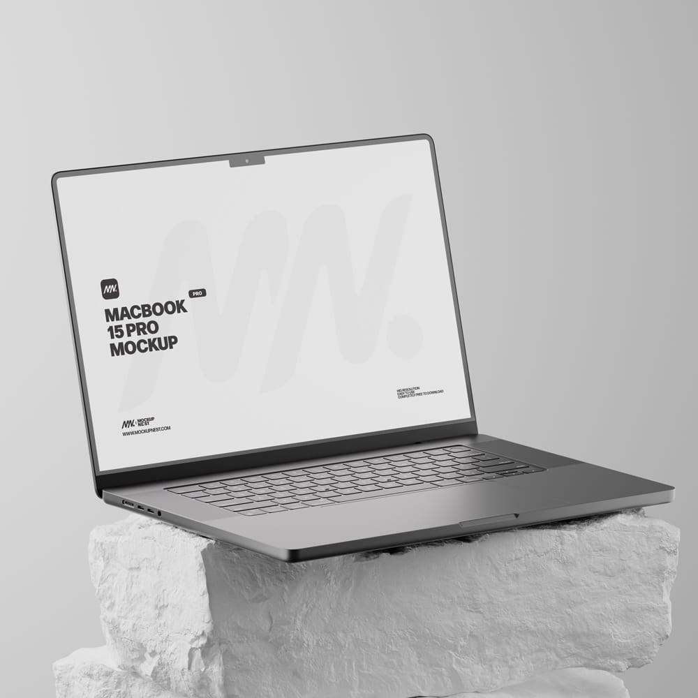 Free Macbook Pro On White Rock Mockup PSD