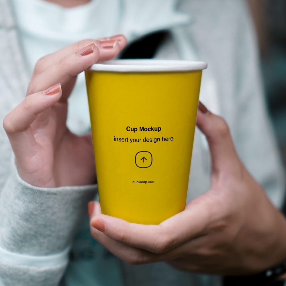 Free Woman Holding Paper Cup Mockup PSD