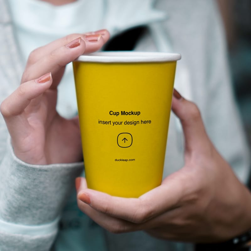 Woman Holding Paper Cup Mockup PSD