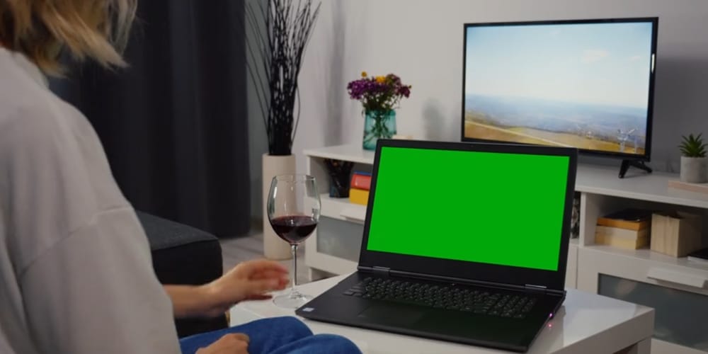 Woman Using Laptop Green Screen