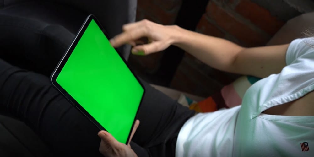 Woman Zooms Screen of Apple Macbook Air