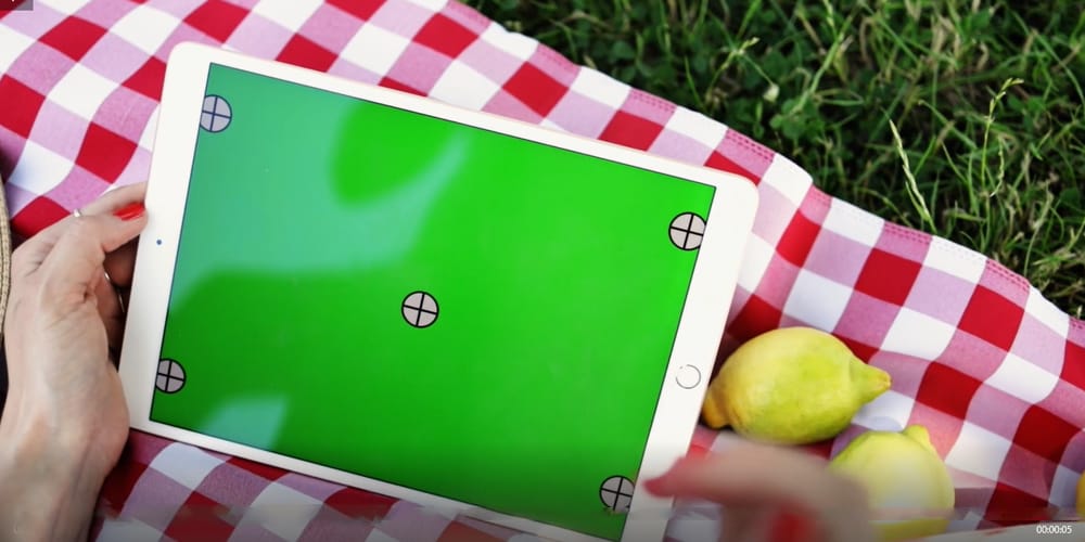 Woman using a white iPad Video Mockup