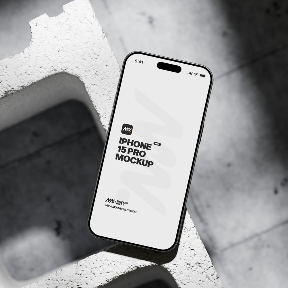 Free Iphone 15 Pro On Concrete Brick Mockup PSD