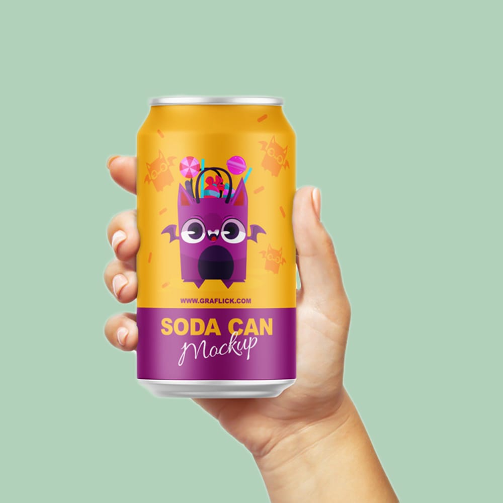 Free Soda Can in Hand Mockup PSD
