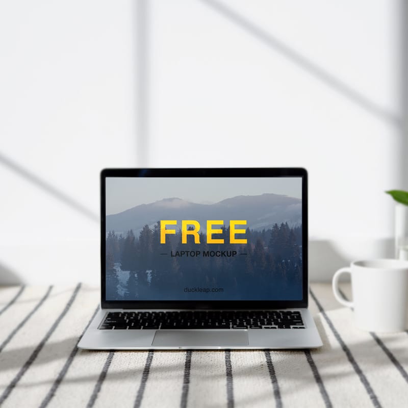 Laptop on a Table Mockup PSD