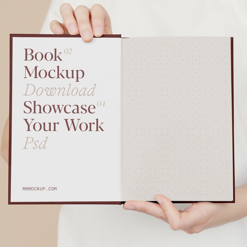 Open Book Holding by Man Mockup PSD