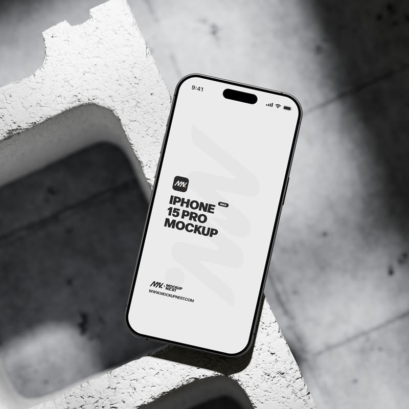 iPhone 15 Pro On Concrete Brick Mockup PSD