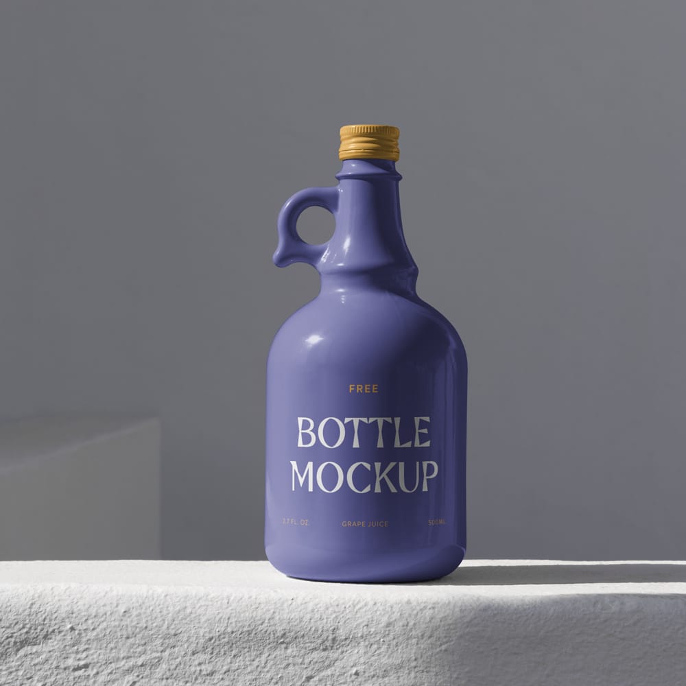 Free Bottle Standing on Concrete Mockup PSD