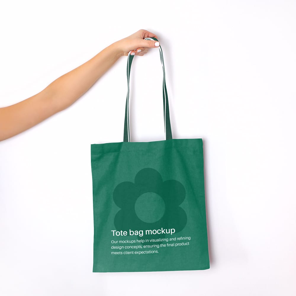 Free Hand Holding Tote Bag Mockup PSD