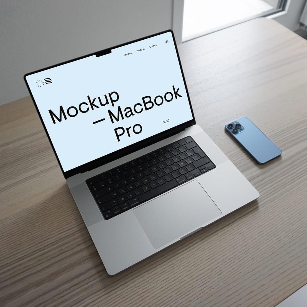 Free MacBook Pro in Office Table Mockup PSD