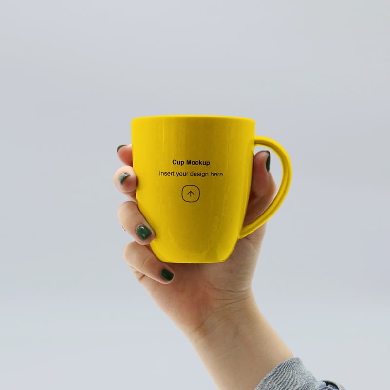 Free Hand Holding Mug Mockup PSD