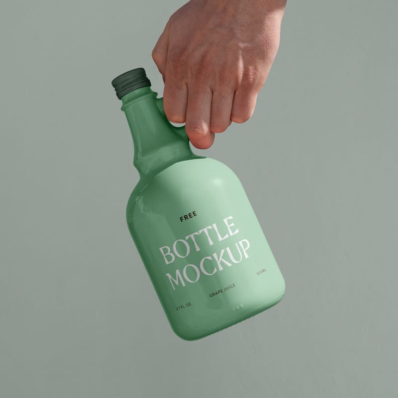 Ceramic Bottle in Hand Mockup PSD