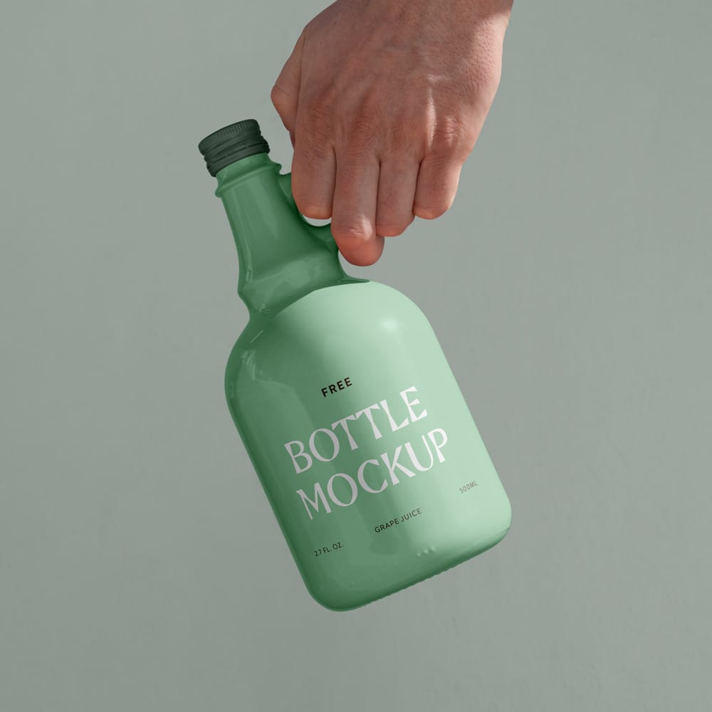 Free Ceramic Bottle in Hand Mockup PSD