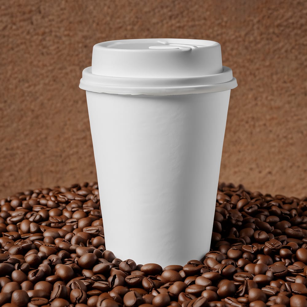 Free Coffee Cup on Beans Mockup PSD