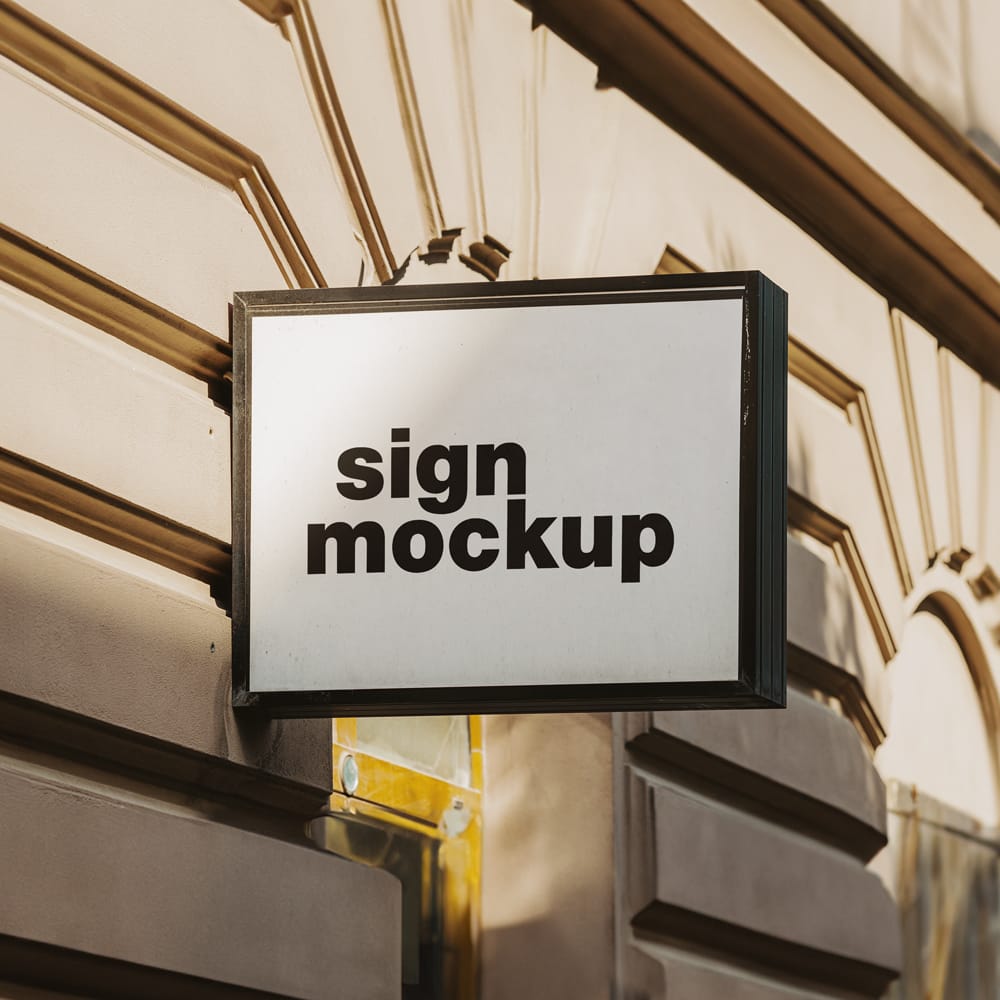 Free Signboard on the Building Wall Mockup PSD