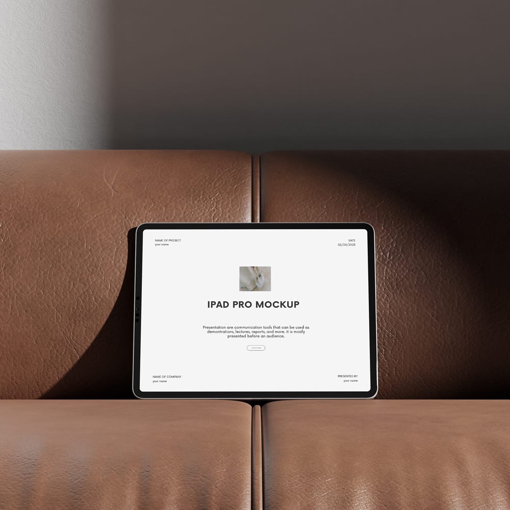 Free iPad Pro on Leather Couch Mockup PSD