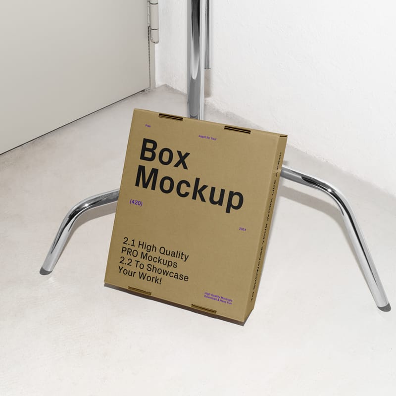 Cardboard Box Leaning Against the Tripod Mockup PSD
