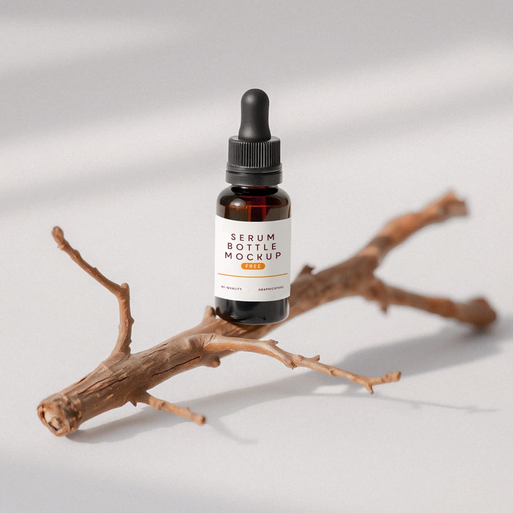 Free Glass Serum Bottle Mockup On A Little Twig PSD