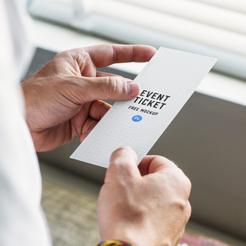 Free Guy Holding Event Ticket Mockup PSD