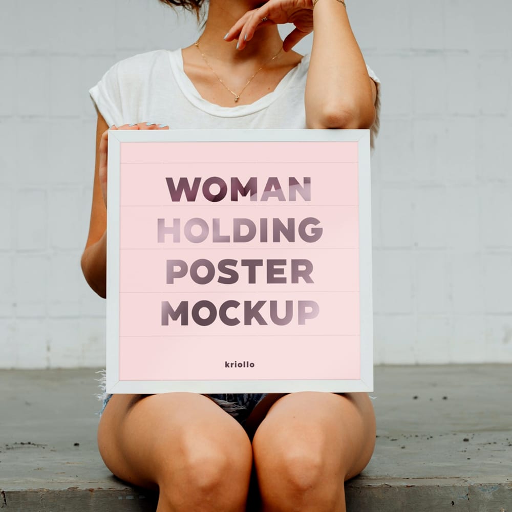 Free Woman Holding Poster Mockup PSD