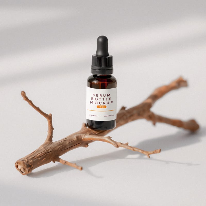 Glass Serum Bottle Mockup On A Little Twig PSD