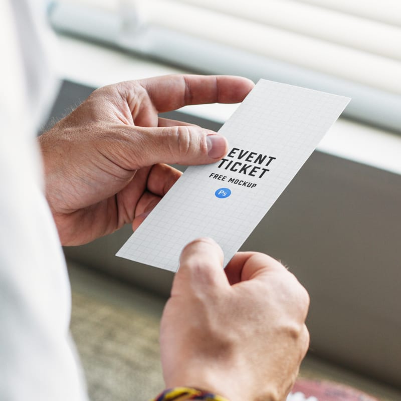 Guy Holding Event Ticket Mockup PSD