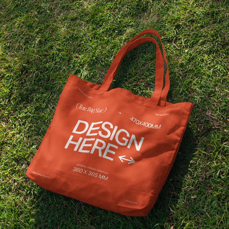 Dropped Tote Bag on Grass Mockup PSD