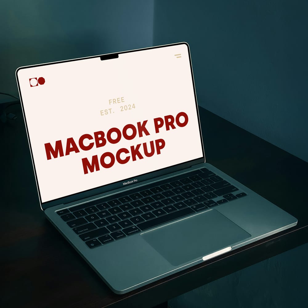Free MacBook Pro on Black Table Mockup PSD