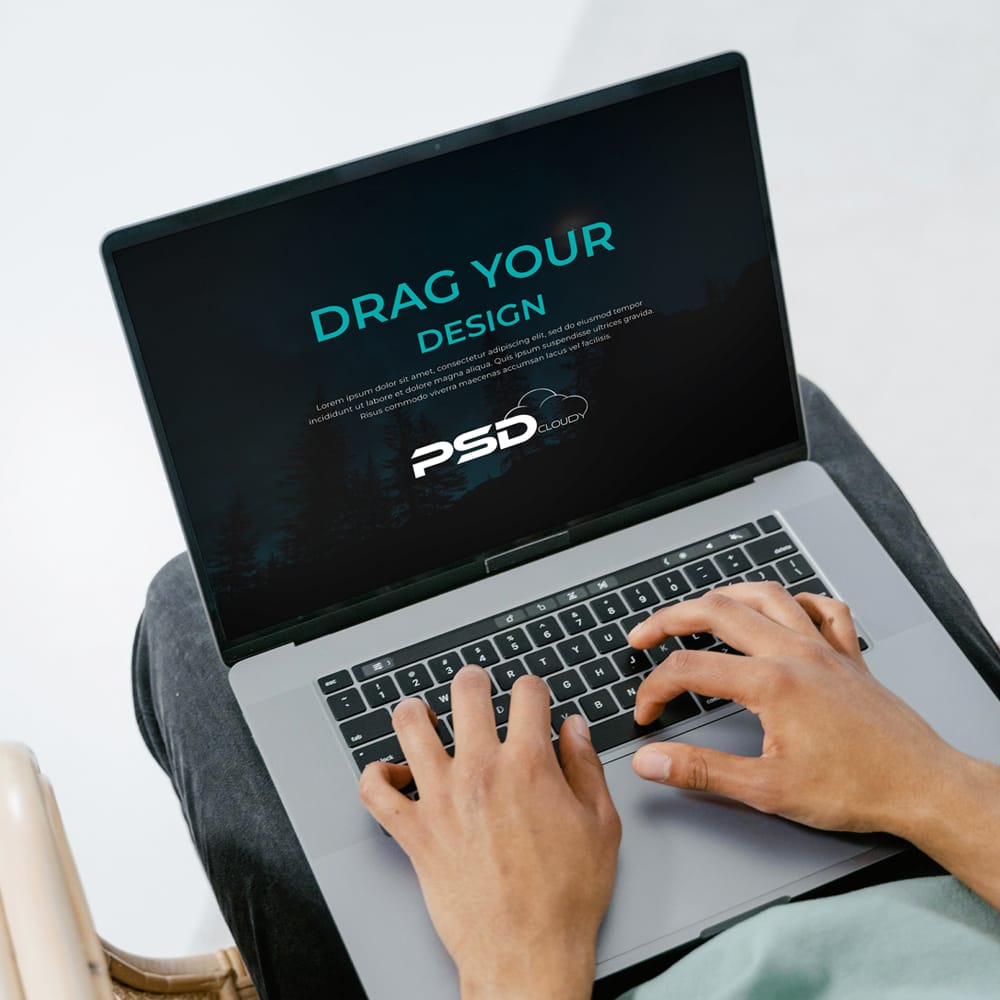 Free Person Using Laptop Mockup PSD