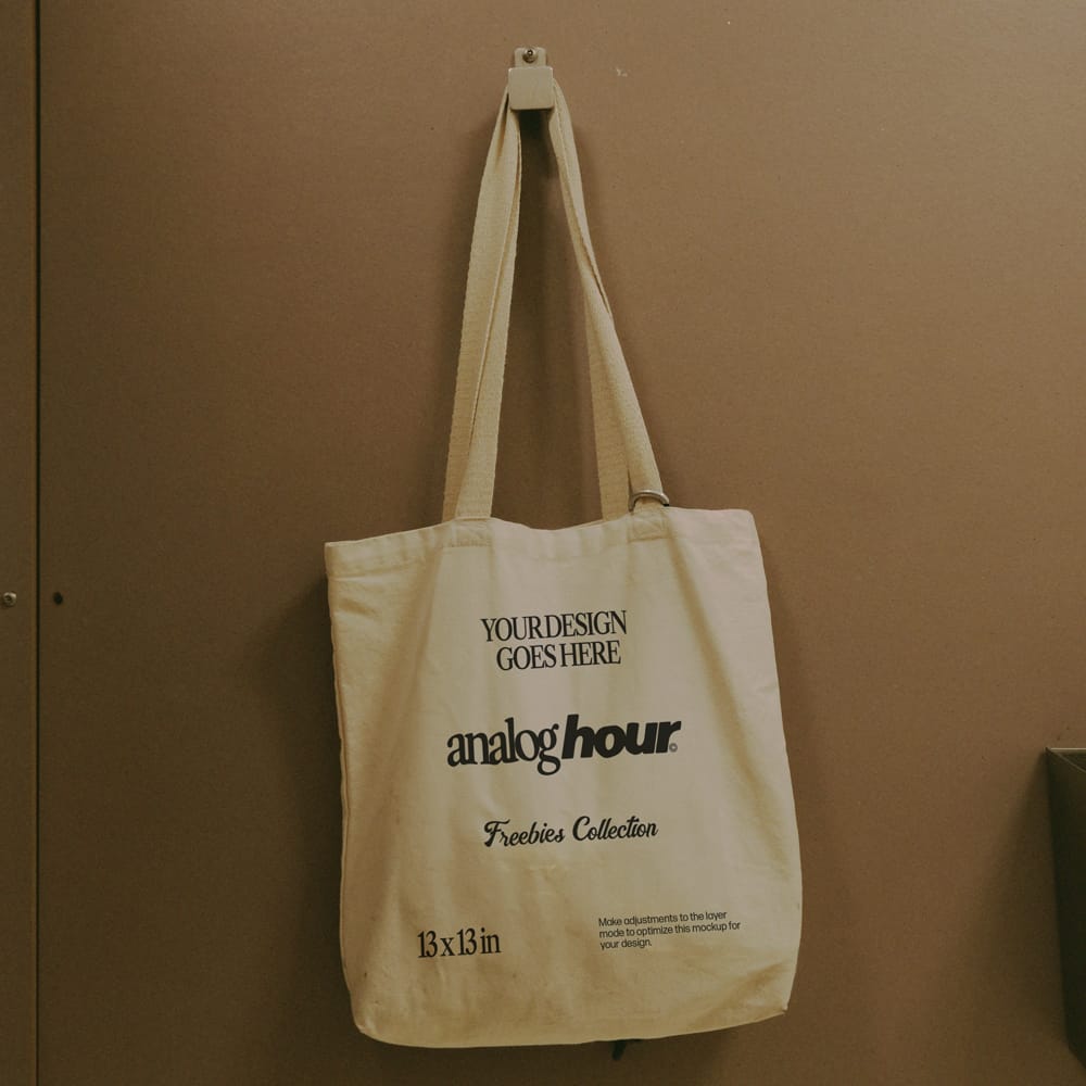 Free Tote Bag Hanging on a Wall Mockup PSD