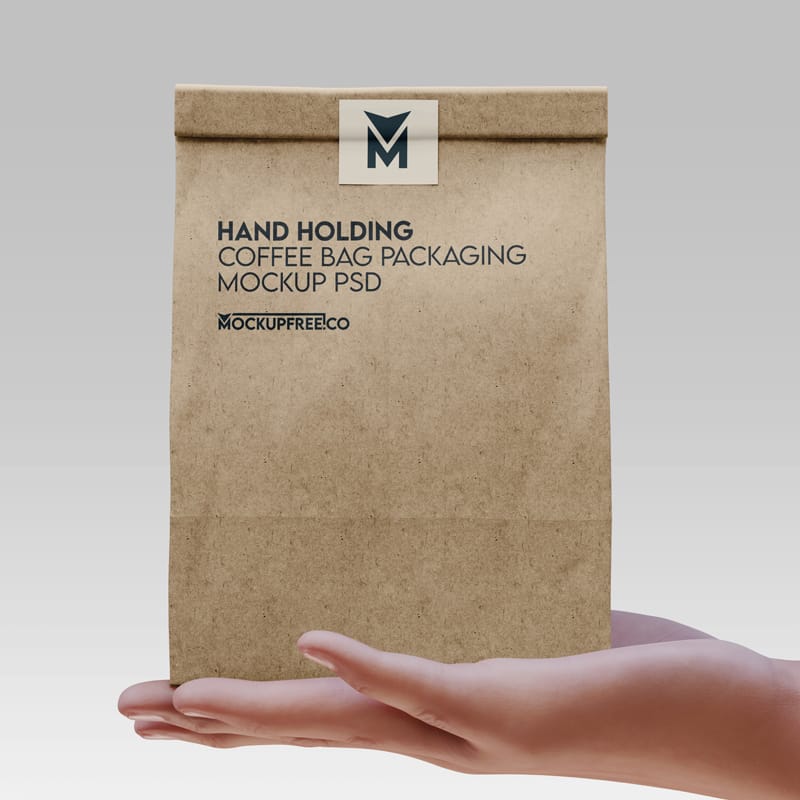 Hand Holding Coffee Bag Mockup PSD