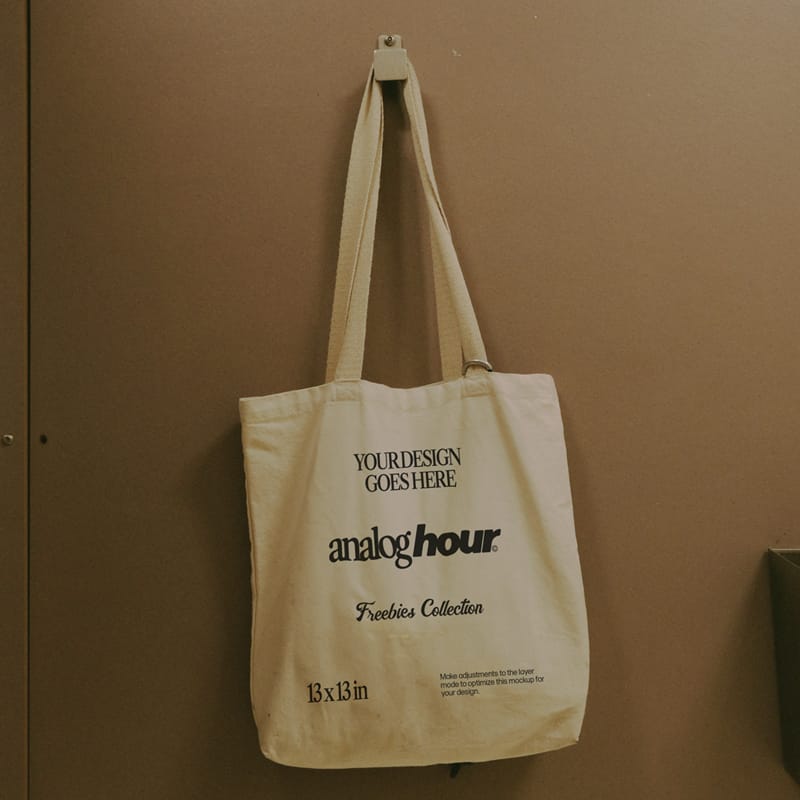 Tote Bag Hanging on a Wall Mockup PSD