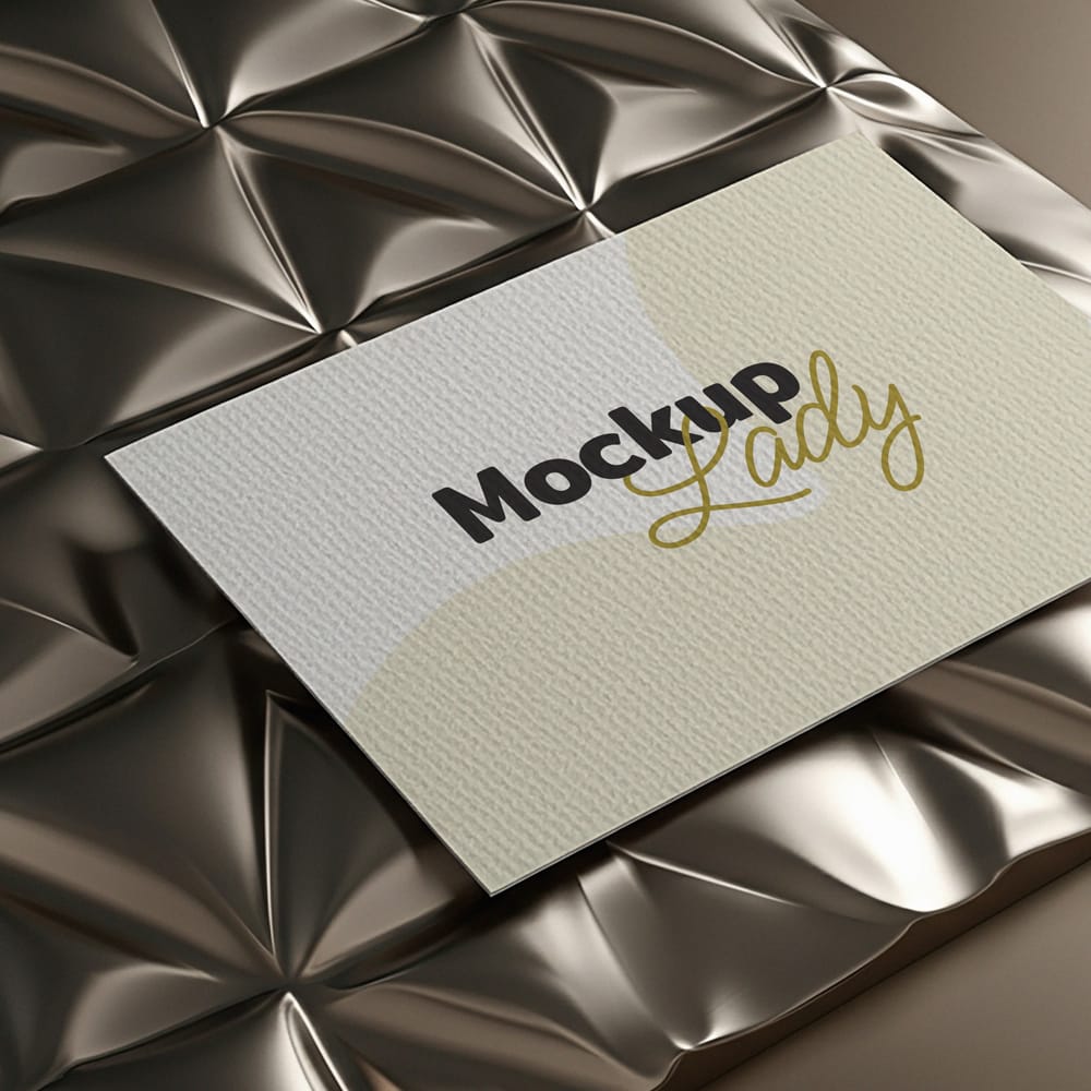 Free Business Card Mockup under Metallic Surface PSD