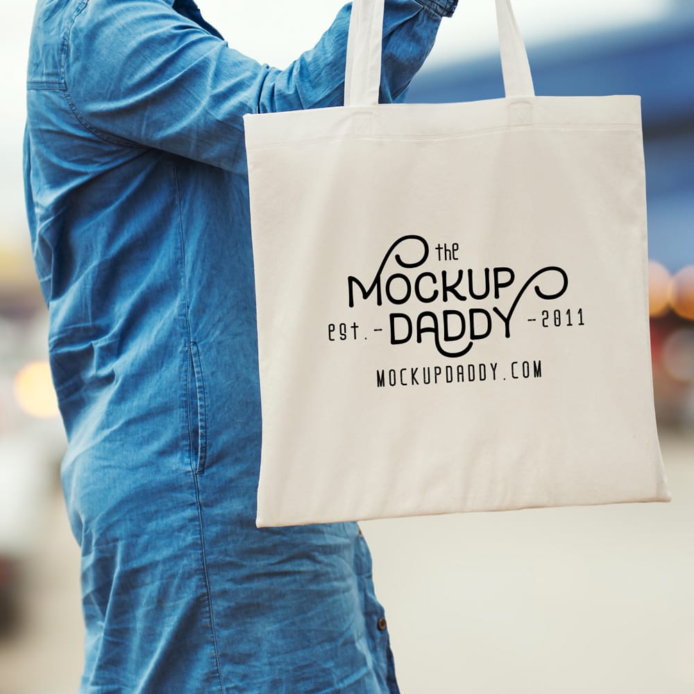 Free Tote Bag in Women Hand Mockup PSD