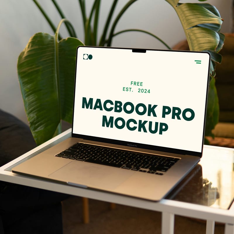 MacBook Pro on Small Table Mockup PSD