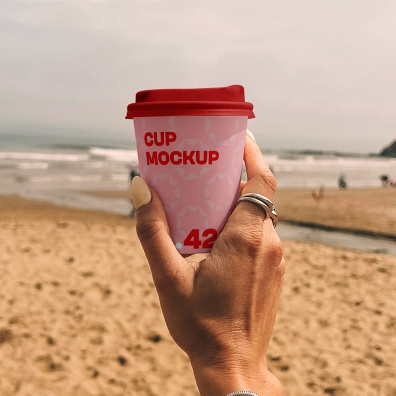 Paper Coffee Cup on the Beach Mockup PSD