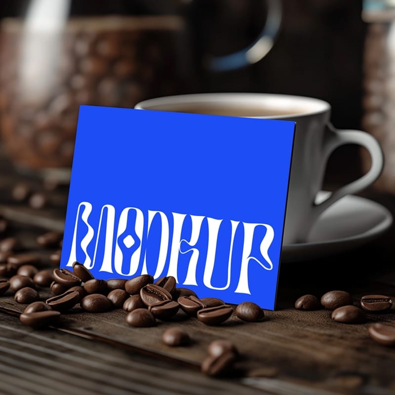 Calling Card Mockup Leaning Beside Coffee Cup PSD