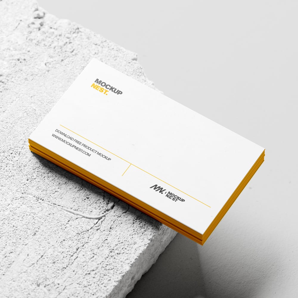 Free Business Card Mockup Stacked On Concrete PSD